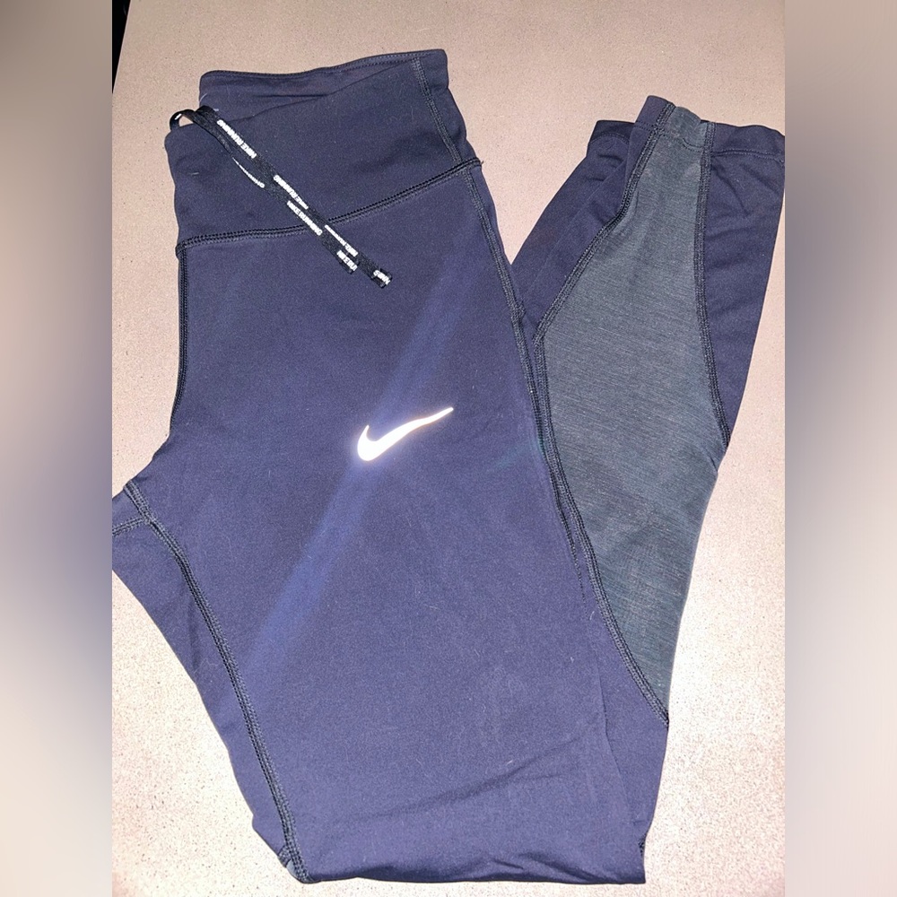 Woman’s Black Nike Dri-Fit leggings with mesh